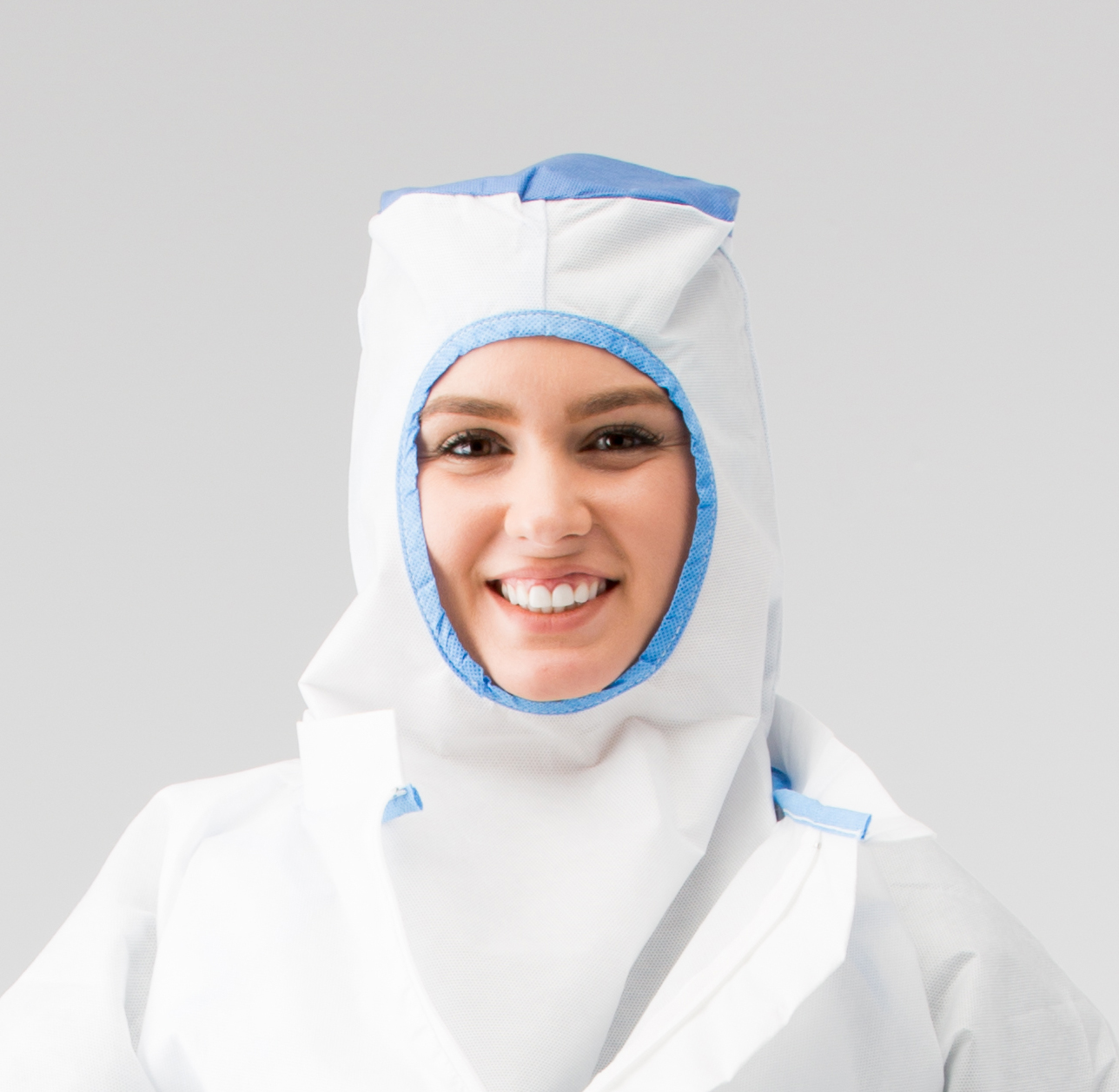 A lady wearing a sterile hood in a cleanroom